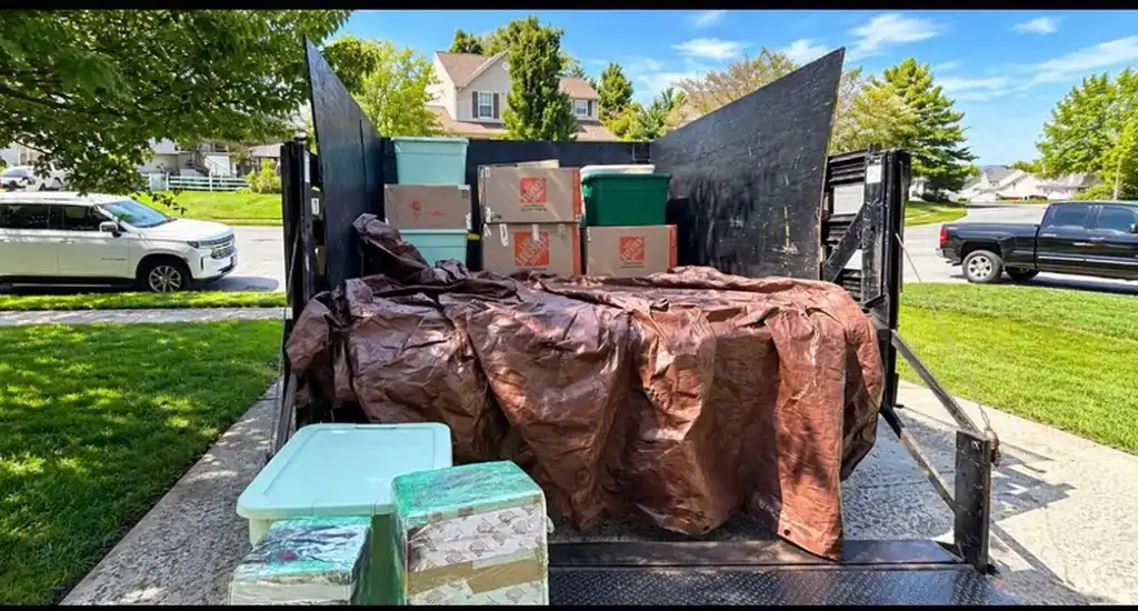 DMV Haul Kings junk removal trailer loaded for hauling
