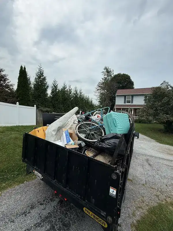 Trailer loaded with household junk